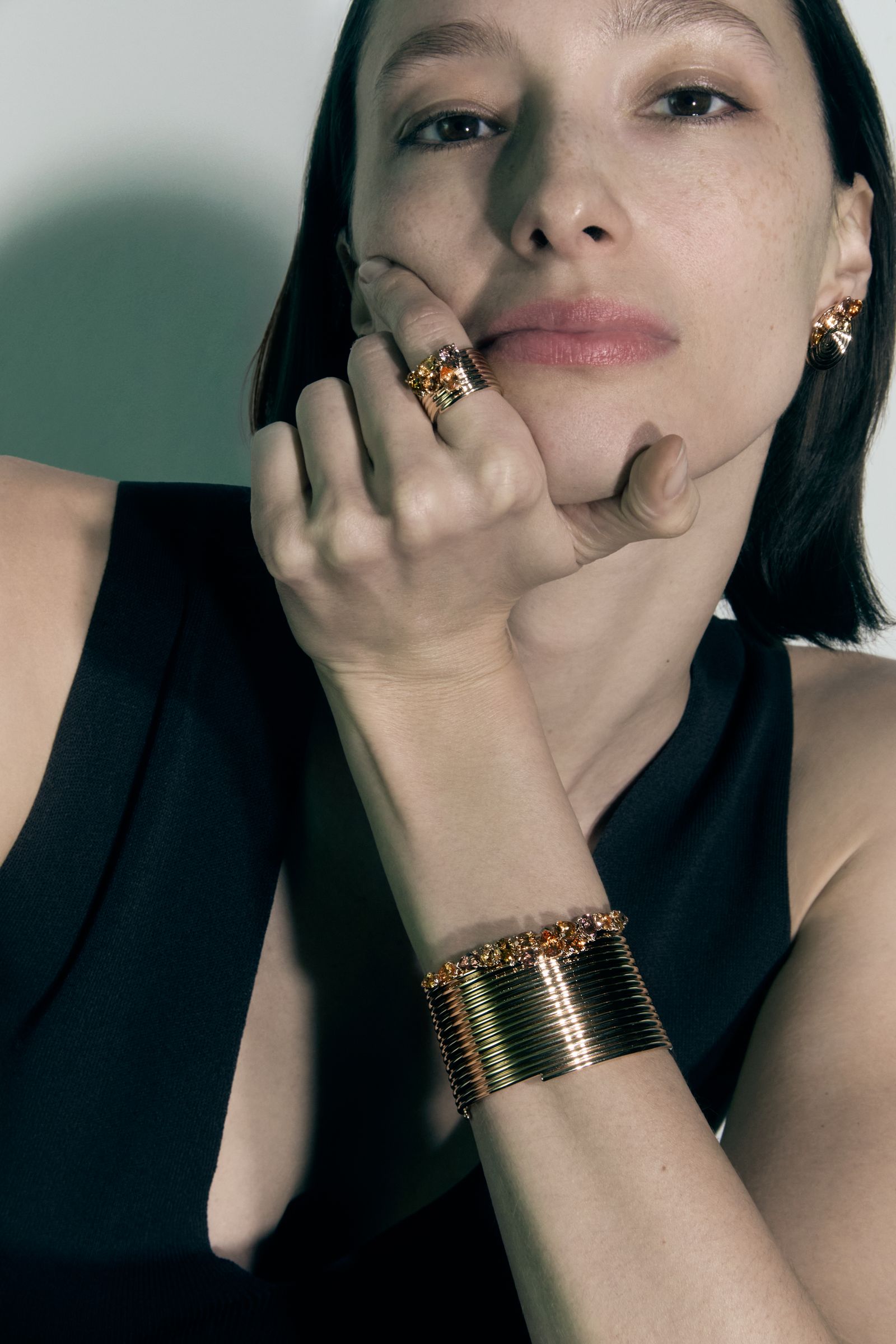 Image may contain Accessories Body Part Finger Hand Person Jewelry Head Face and Bracelet