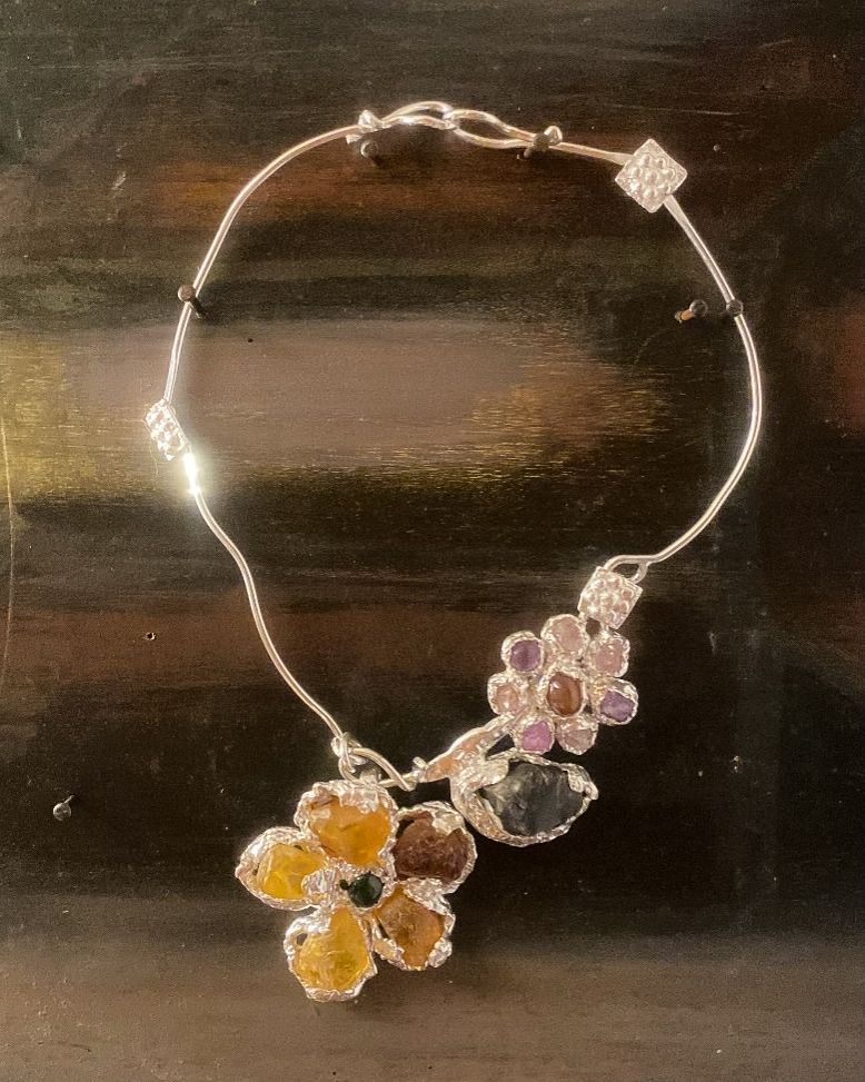 Image may contain Accessories Jewelry Necklace Locket Pendant Diamond and Gemstone